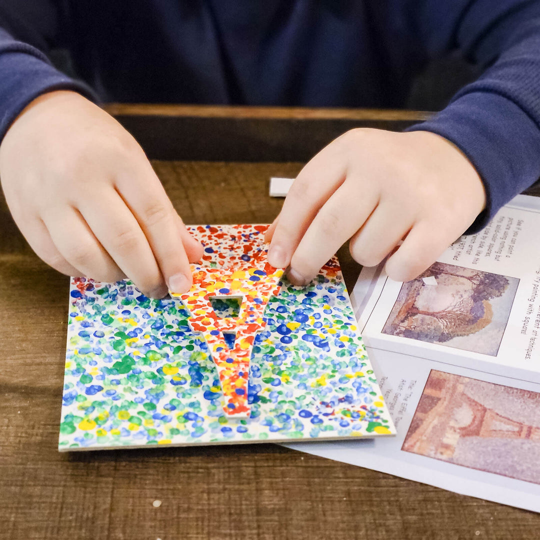 Womple Studios WompleBox: France photograph of person's hands doing craft activity
