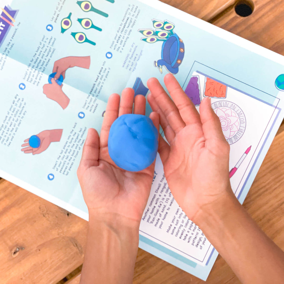 Womple Studios WompleBox: India photograph of person's hands doing craft activity