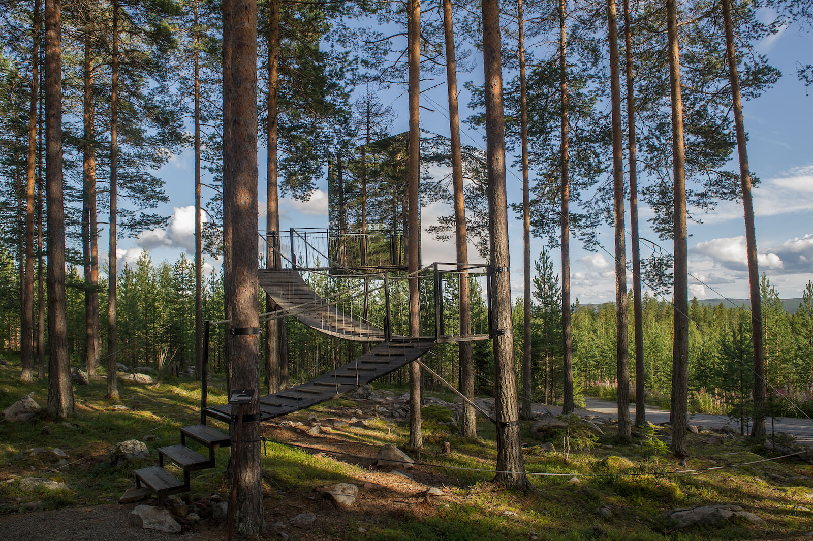 Mirrorcube treehouse located in the woods of Sweden