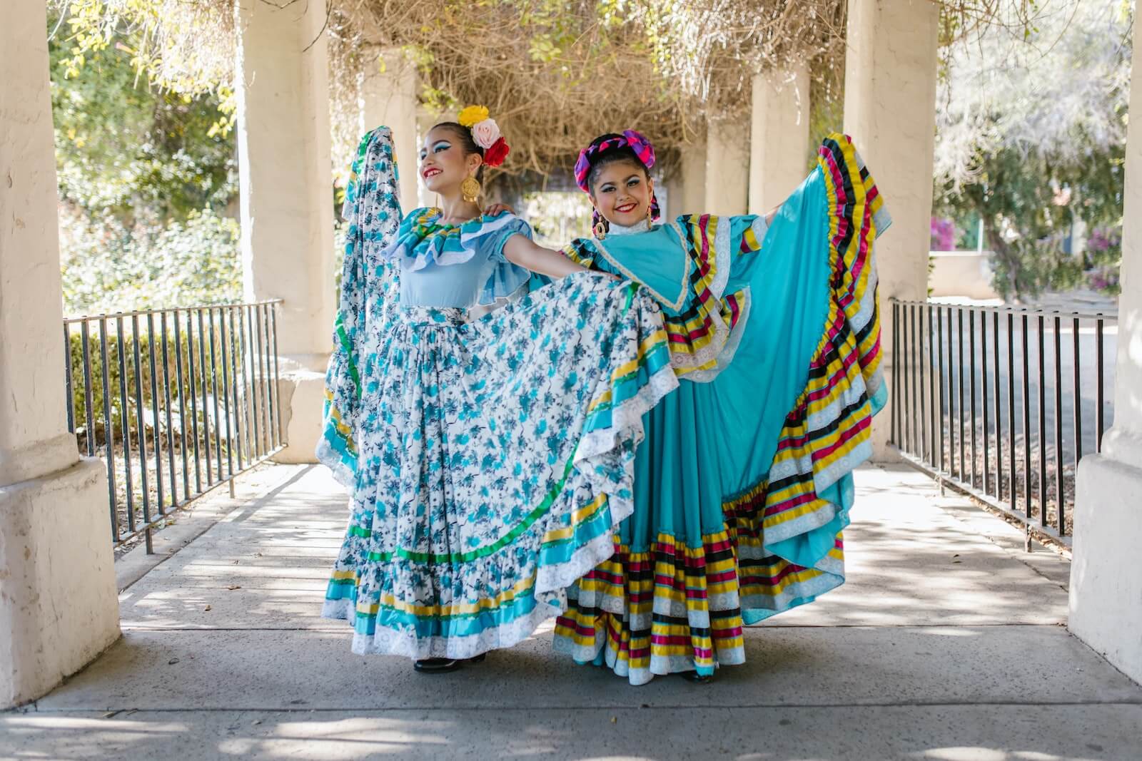 Two women dancing in their dresses for Cinco De Mayo in Mexico