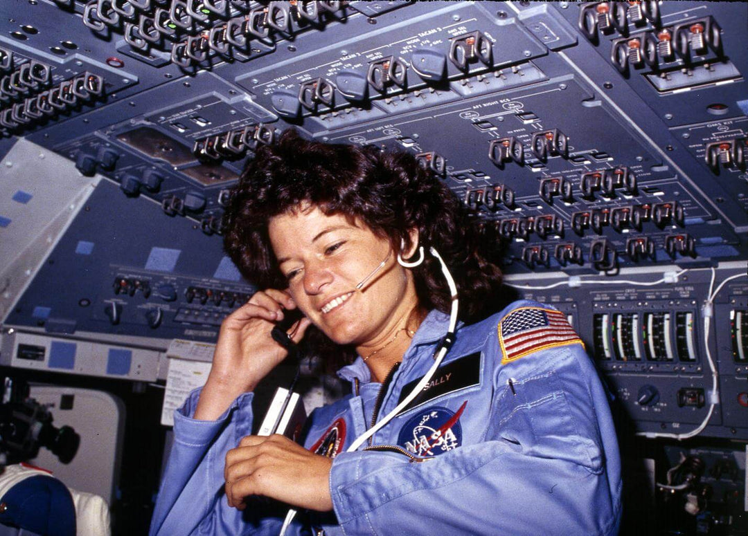 Sally Ride putting on her headset inside of the space station