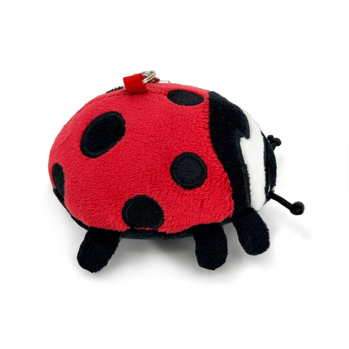 Plush ladybug keychain toy on a white background, side