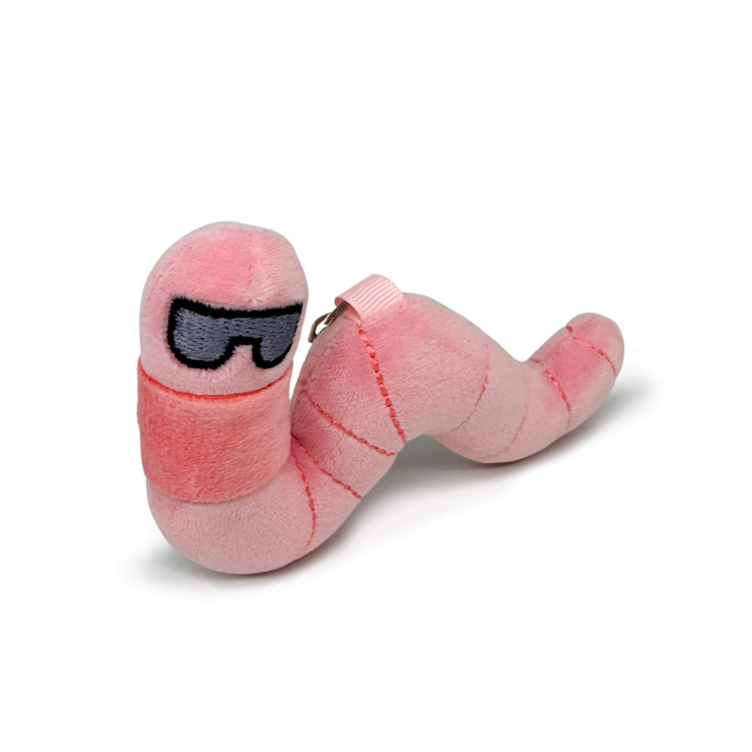 Pink plush earthworm toy keychain with sunglasses on a white background