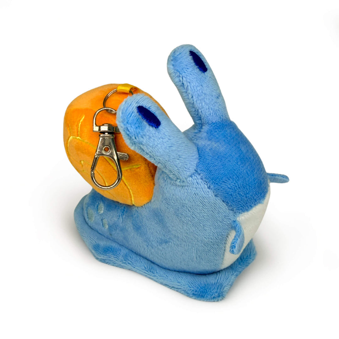Blue plush toy snail keychain with an orange shell on a white background