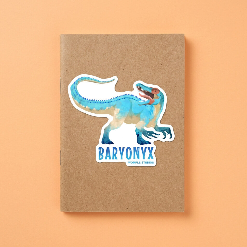 Notebook with a Baryonyx dinosaur sticker on an orange background