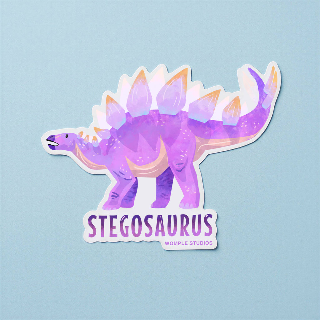 Stegosaurus sticker with gradient colors on a light blue background