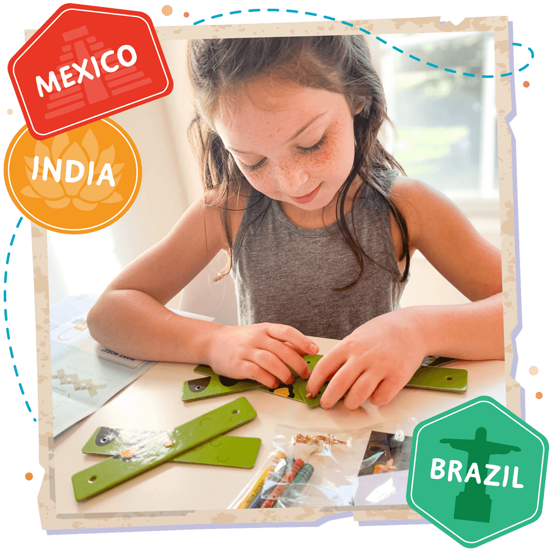 Womple Studios girl doing WompleBox: Brazil anaconda craft activity