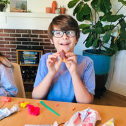 Boy building kiwi using WompleBox: New Zealand craft materials