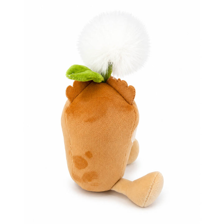 A plush toy shaped like a small brown dandelion seed with a large white fluffy pom-pom seed head on top and a small green leaf detail, photographed from the side on a clean white background.
