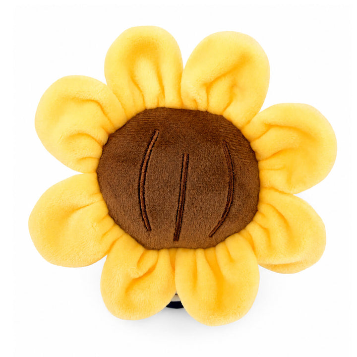 A top-down view of a plush toy sunflower with soft yellow petals and a brown center, photographed on a plain white background.